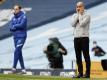 Pep Guardiola (r) verlor mit Man City gegen den FC Chelseas und Thomas Tuchel. Foto: Martin Rickett/Pool PA/AP/dpa