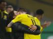 Pokalsieger: BVB-Coach Edin Terzic und Kapitän Marco Reus. Foto: Jan Woitas/dpa-Pool/dpa