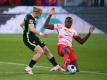 Ibrahima Konaté (r) wechselt nach Liverpool. Foto: Jan Woitas/dpa-Pool/dpa