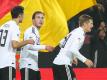 Mario Götze (M) und Toni Kroos (r) waren Teamkollegen in der Nationalmannschaft und bei Bayern München. Foto: picture alliance / Christian Charisius/dpa