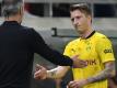 BVB-Cheftrainer Marco Rose (l) kann sich eine Nationalmannschaftsrückkehr von Marco Reus gut vorstellen. Foto: Arne Dedert/dpa