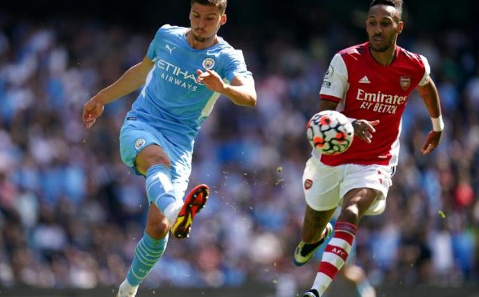 Manchester City verlängerte den Vertrag von Ruben Dias (l). Foto: Nick Potts/PA Wire/dpa