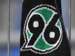 Das Logo von Hannover 96. Foto: Swen Pförtner/dpa/Archivbild