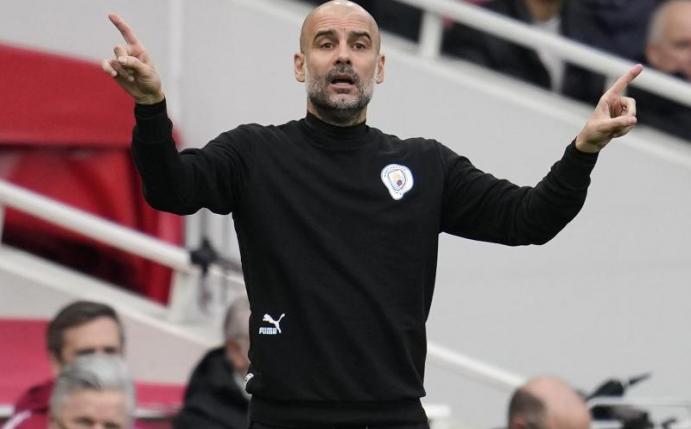 Manchester Citys Coach Pep Guardiola hat sich mit dem Coronavirus infiziert. Foto: Matt Dunham/AP/dpa