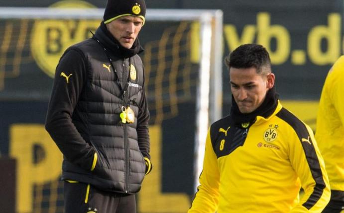 Trainer Thomas Tuchel (l) hofft, dass Ilkay Gündogan beim BVB bleibt. Foto: Bernd Thissen